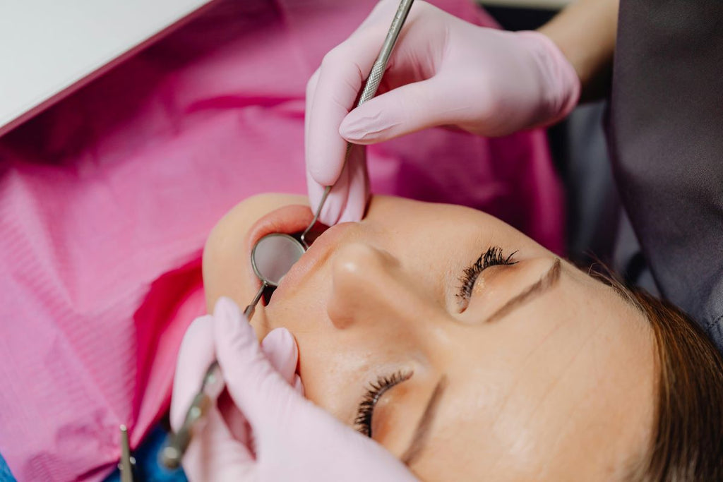 Dentist looking at woman's teeth