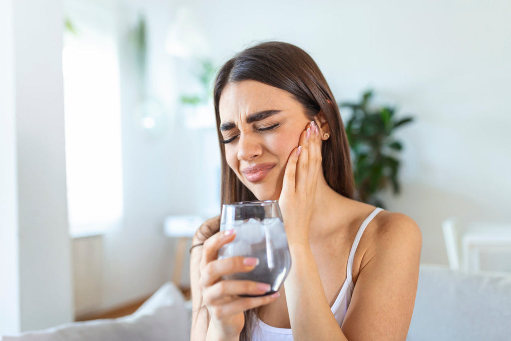 Here's Why Your Teeth Are Sensitive & How to Fix It