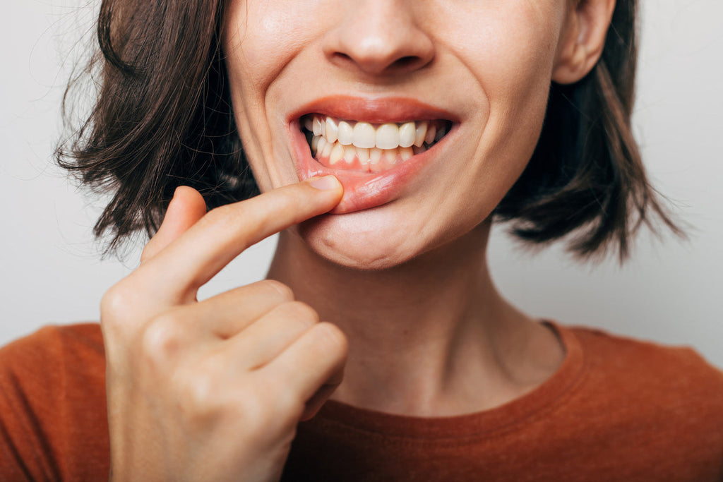 woman with pain in teeth and gums