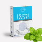 Box of Puradent retainer cleaning tablets with a mint leaf on a white background